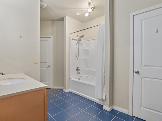 bathroom with tile patterned floors, shower / bath combo, and vanity