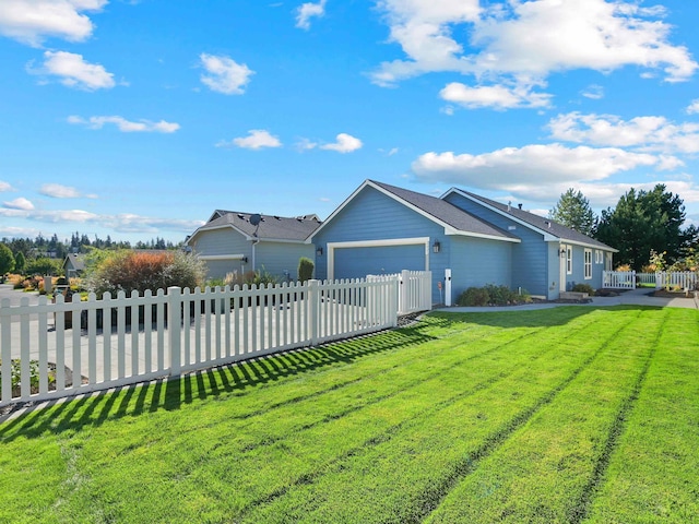 single story home featuring a front yard and a garage