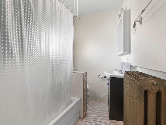 full bathroom featuring vanity, radiator, shower / bath combination with curtain, tile patterned flooring, and toilet