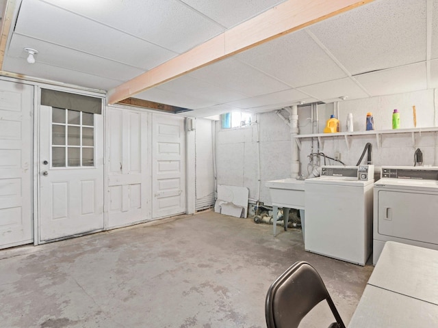 laundry area with washing machine and dryer and sink