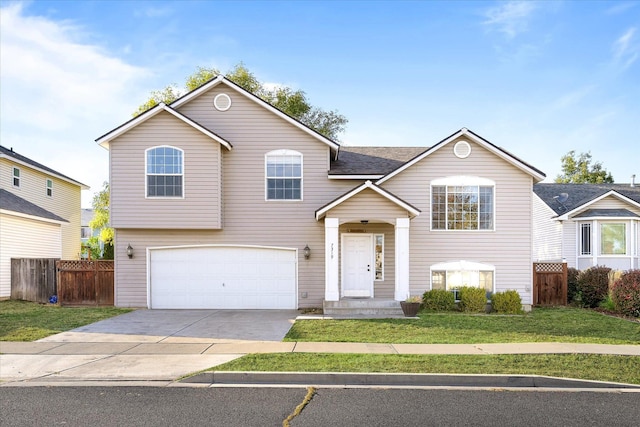 raised ranch with a garage and a front lawn