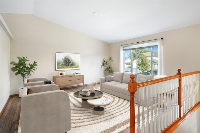 living room featuring hardwood / wood-style floors and lofted ceiling