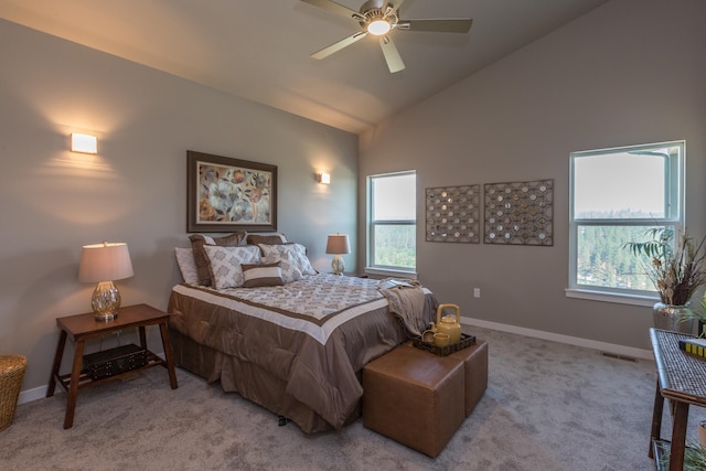 bedroom featuring light carpet, multiple windows, vaulted ceiling, and visible vents