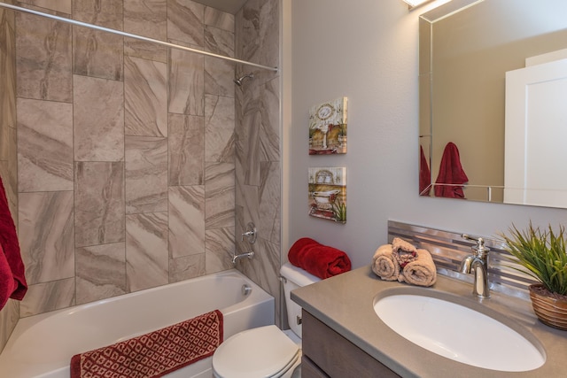 bathroom featuring shower / tub combination, vanity, and toilet