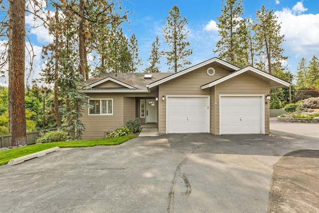 single story home featuring a garage