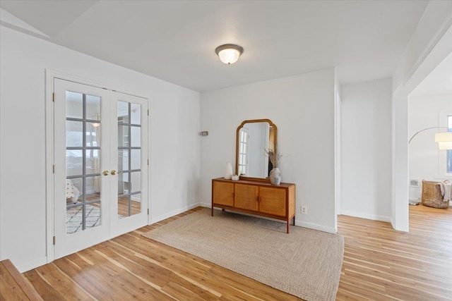 interior space featuring wood-type flooring and french doors