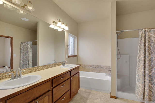 bathroom featuring vanity and separate shower and tub