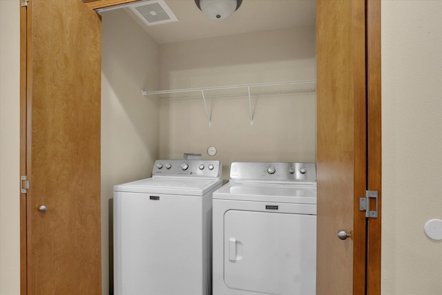 laundry room featuring independent washer and dryer