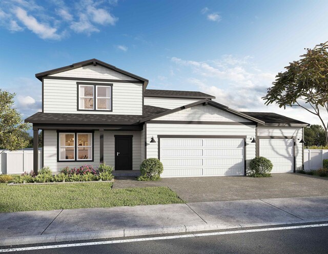 view of front of house featuring a garage and a front yard