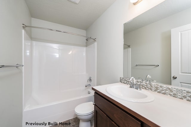 full bathroom with backsplash, vanity, a textured ceiling, bathing tub / shower combination, and toilet