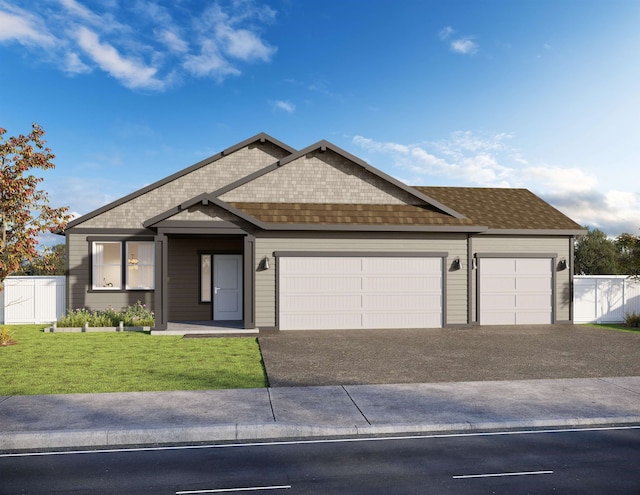 view of front of home featuring a garage and a front lawn