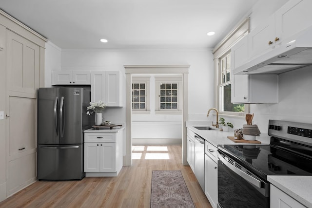 kitchen featuring ventilation hood, stainless steel appliances, sink, white cabinets, and light hardwood / wood-style floors