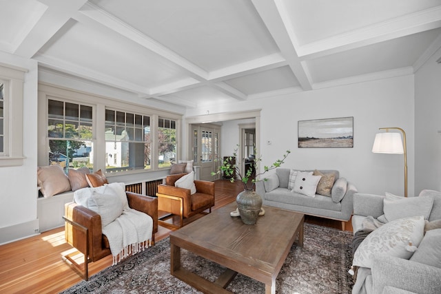 living room with beam ceiling, coffered ceiling, and hardwood / wood-style flooring