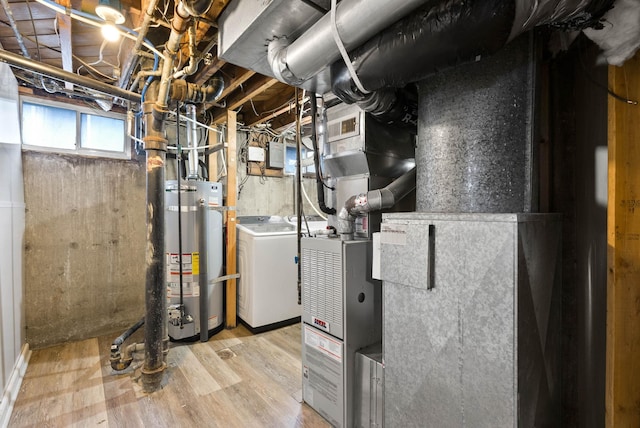 utility room featuring washer / dryer and gas water heater