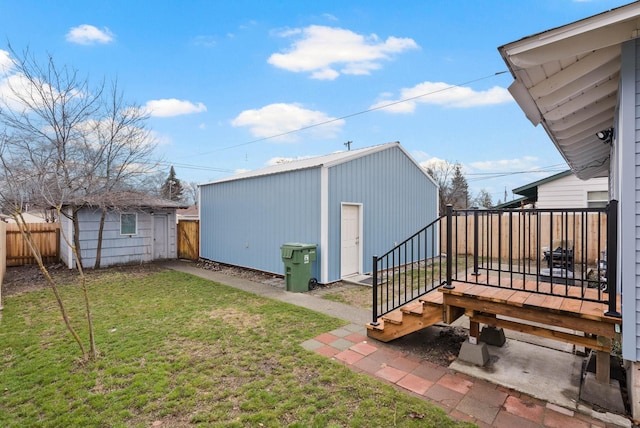 view of yard with a storage shed and a deck