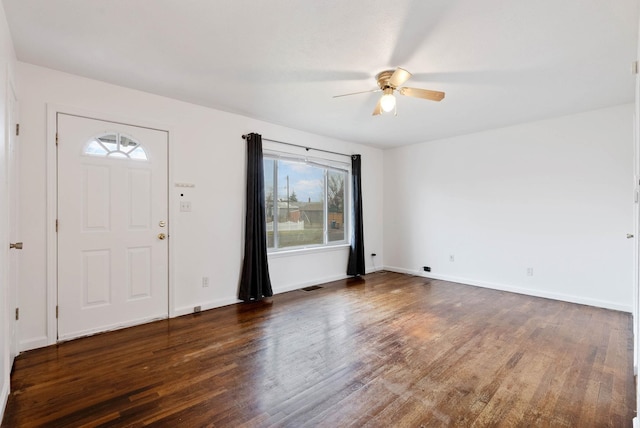 entrance foyer featuring ceiling fan and dark wood-type flooring