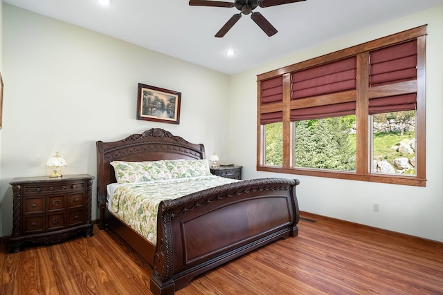 bedroom featuring hardwood / wood-style flooring and ceiling fan