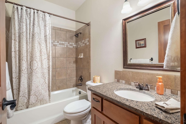 full bathroom featuring tasteful backsplash, shower / bath combo with shower curtain, vanity, and toilet