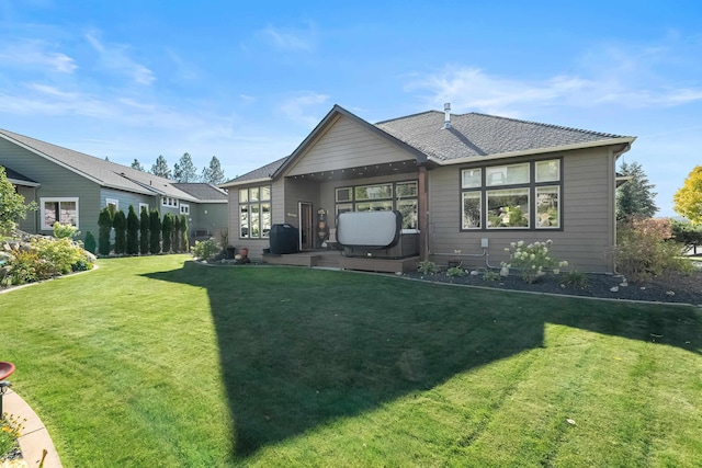 back of house featuring a yard