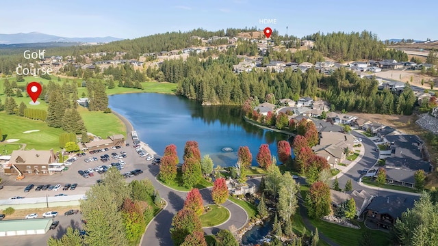 drone / aerial view featuring a water and mountain view