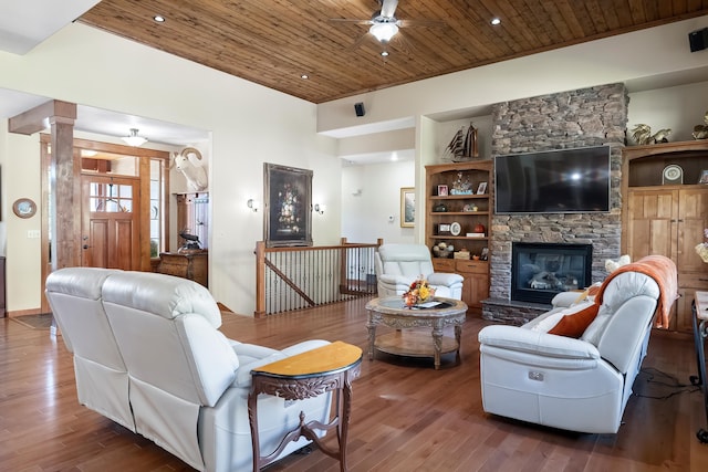 living room featuring a fireplace, hardwood / wood-style floors, ceiling fan, and wooden ceiling