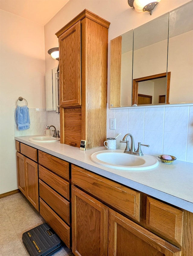 bathroom featuring vanity and backsplash