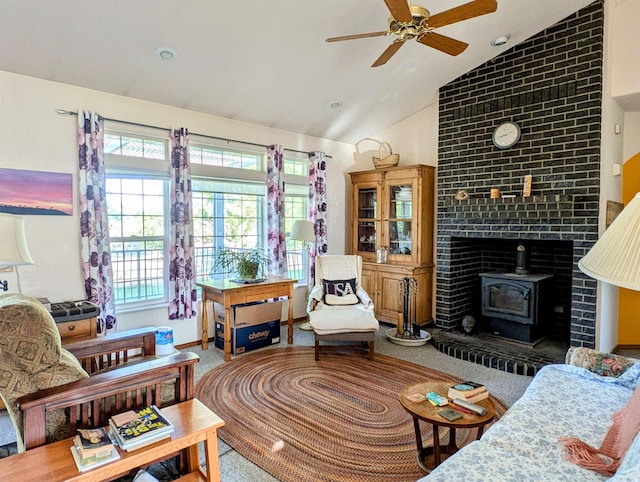 carpeted living room with high vaulted ceiling, ceiling fan, and a wood stove