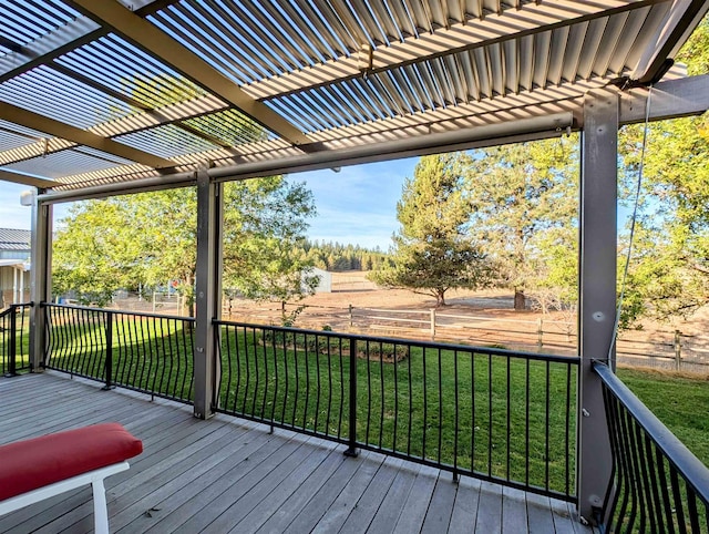 wooden deck with a yard and a pergola