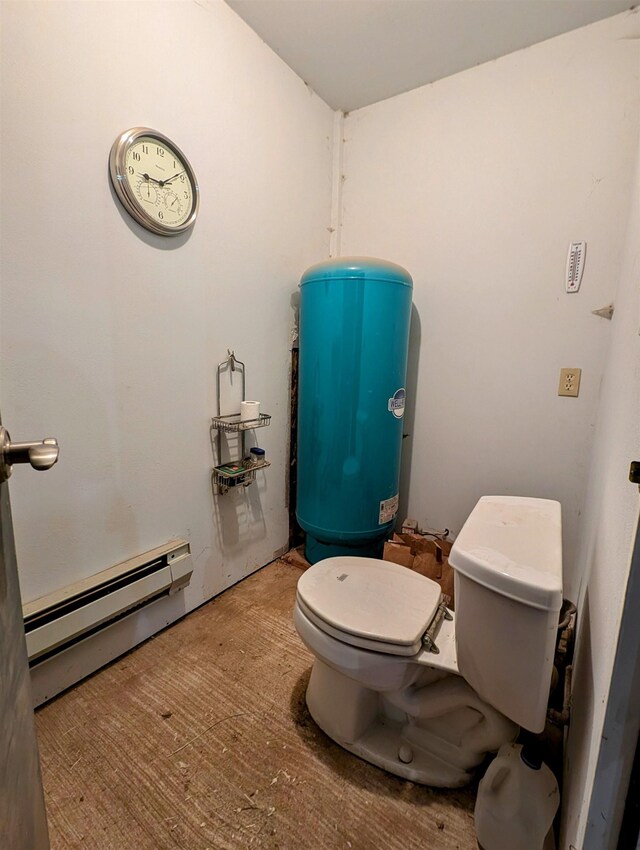 bathroom with toilet and a baseboard heating unit