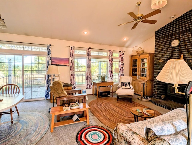 living room featuring high vaulted ceiling, ceiling fan, and carpet flooring