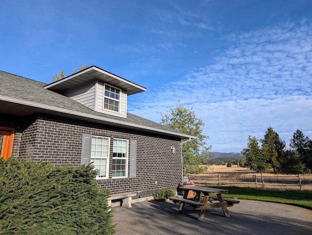 view of side of property featuring a patio area