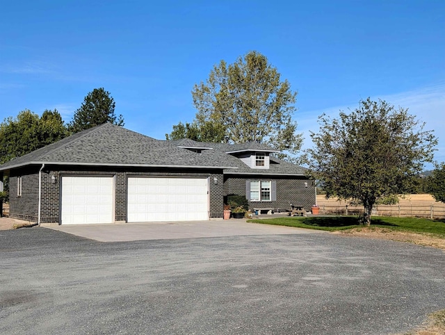 view of front of property featuring a garage