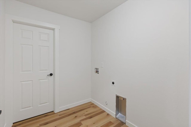 laundry area with electric dryer hookup, washer hookup, and light wood-type flooring