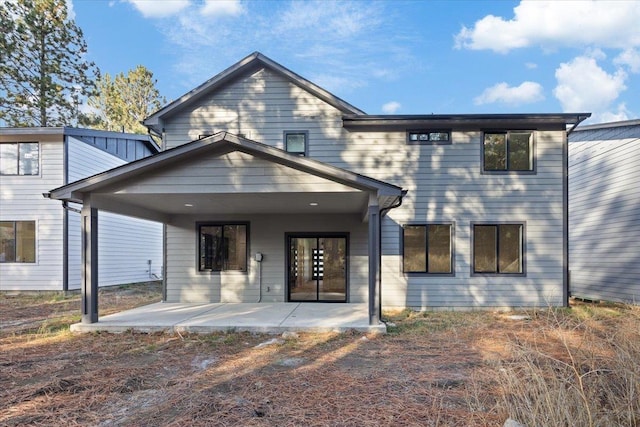 view of front facade with french doors and a patio