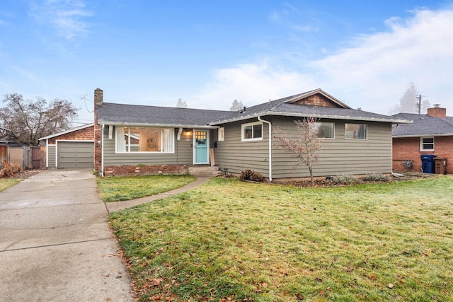 ranch-style house featuring a front yard, a garage, and an outbuilding