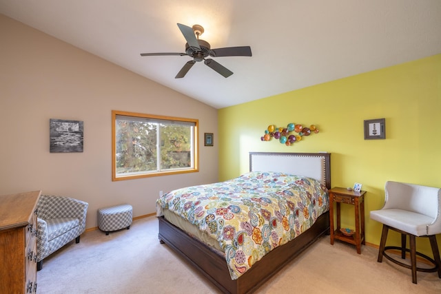 carpeted bedroom featuring ceiling fan and vaulted ceiling