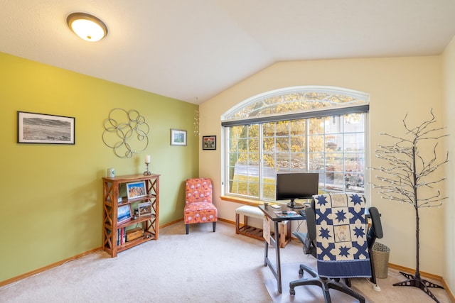 carpeted office featuring a healthy amount of sunlight and vaulted ceiling