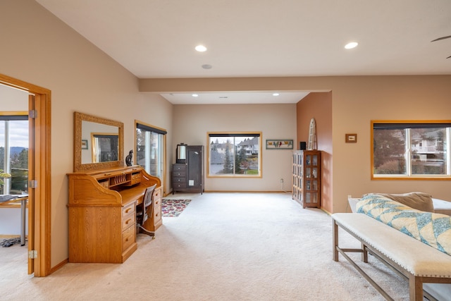 living room featuring a healthy amount of sunlight and light colored carpet