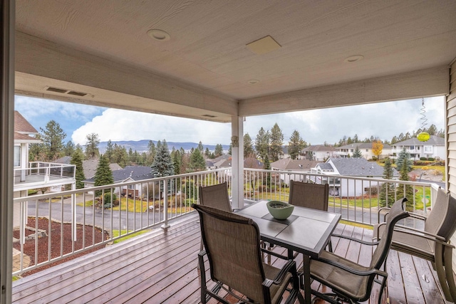 wooden terrace featuring a mountain view