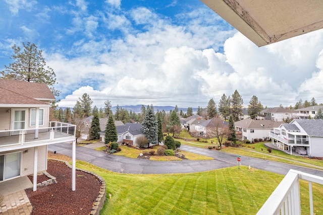 view of yard with a balcony