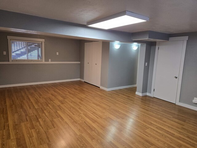 carpeted empty room with ornamental molding and wooden walls