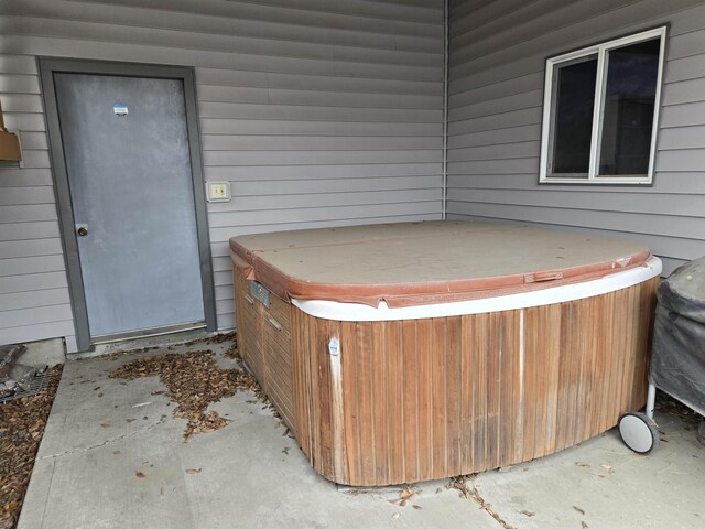 exterior space featuring a hot tub