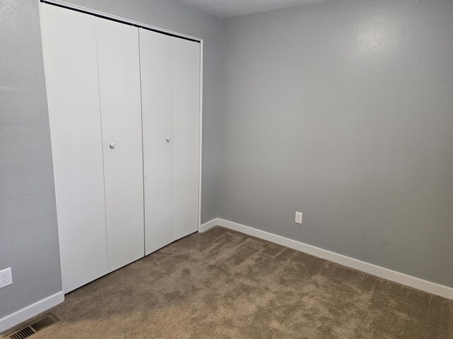 basement featuring a textured ceiling and hardwood / wood-style floors