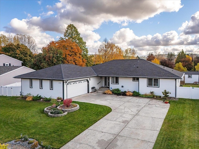 ranch-style house with a garage and a front yard