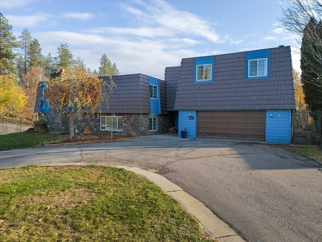 view of front of property with a garage