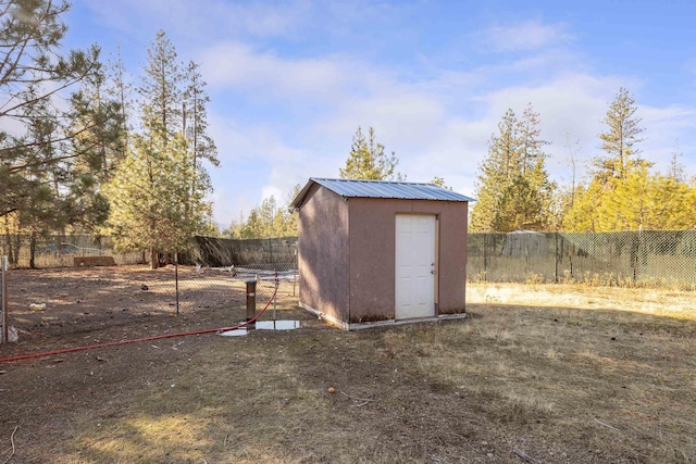 view of outbuilding with a yard