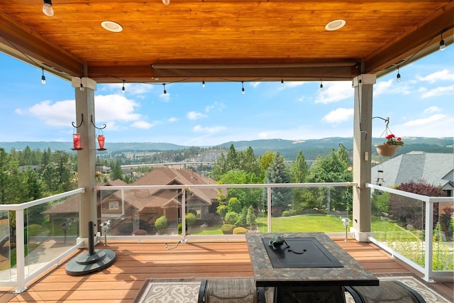 wooden terrace with a mountain view