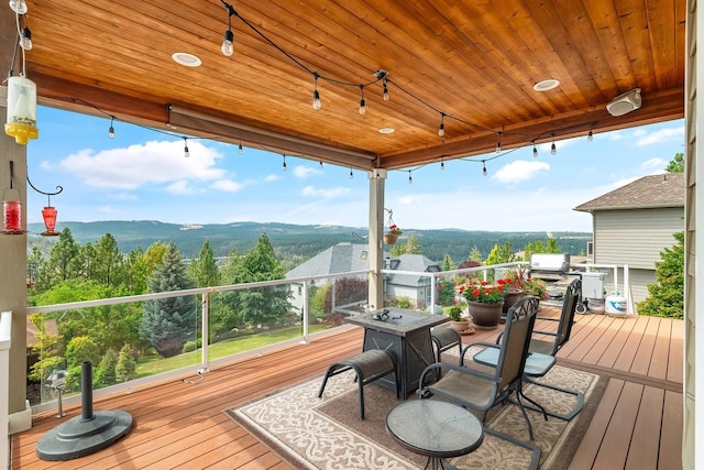 wooden deck featuring a mountain view