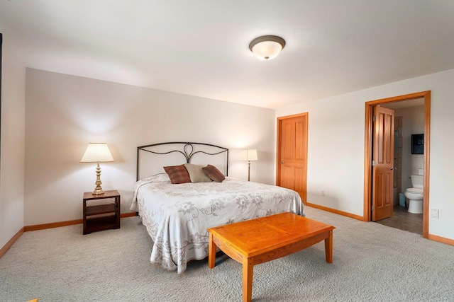 bedroom featuring carpet and ensuite bath