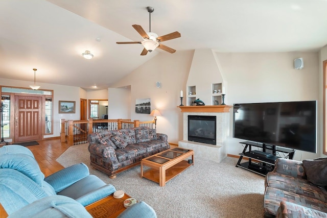 living room featuring ceiling fan and lofted ceiling